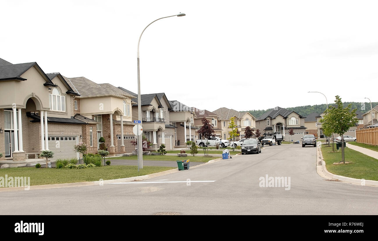 A street of new beautiful big houses in a new suburb Stock Photo - Alamy