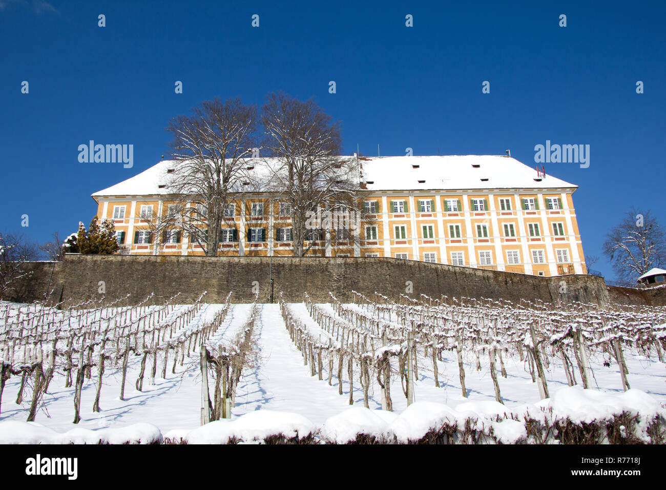 castle stainz partly covered with snow in winter at the day Stock Photo