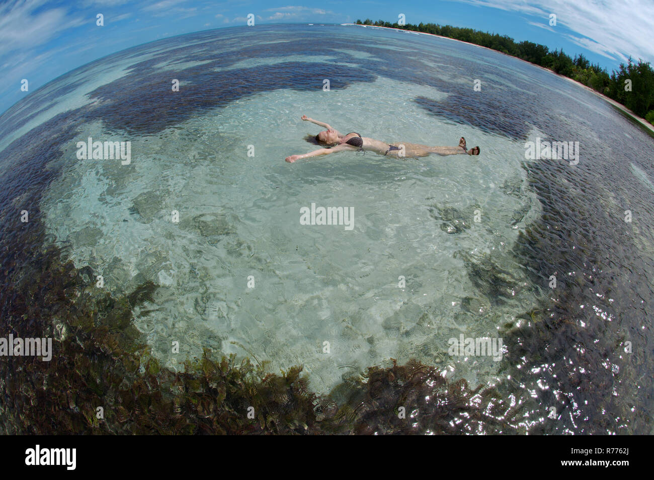 Young woman lying in water hi-res stock photography and images - Alamy