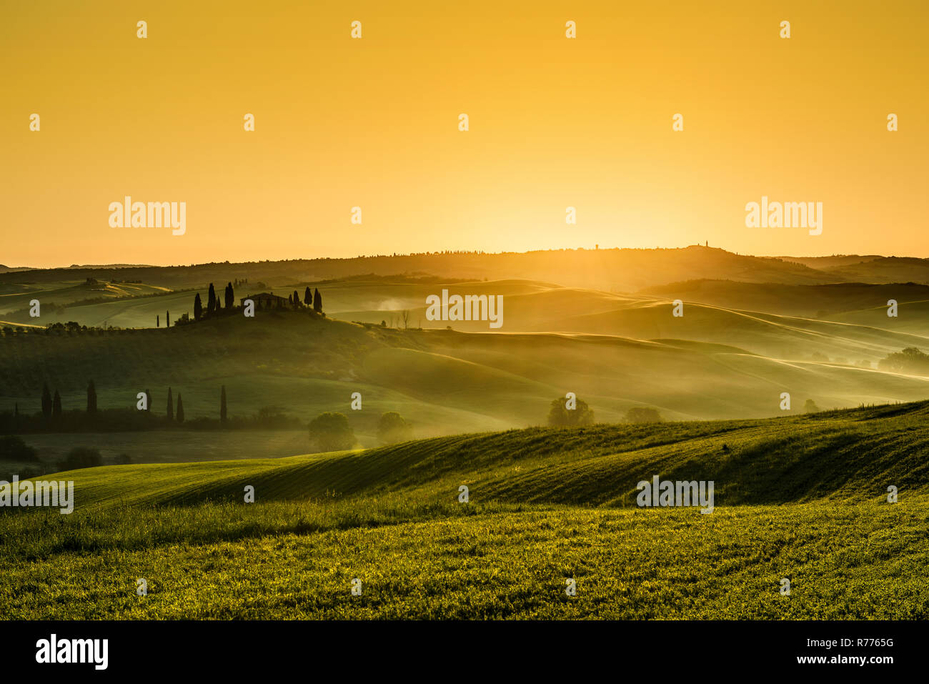 Sunrise, landscape with farmhouse and cypress trees, near San Quirico d'Orcia, Val d'Orcia, Province of Siena, Tuscany, Italy Stock Photo