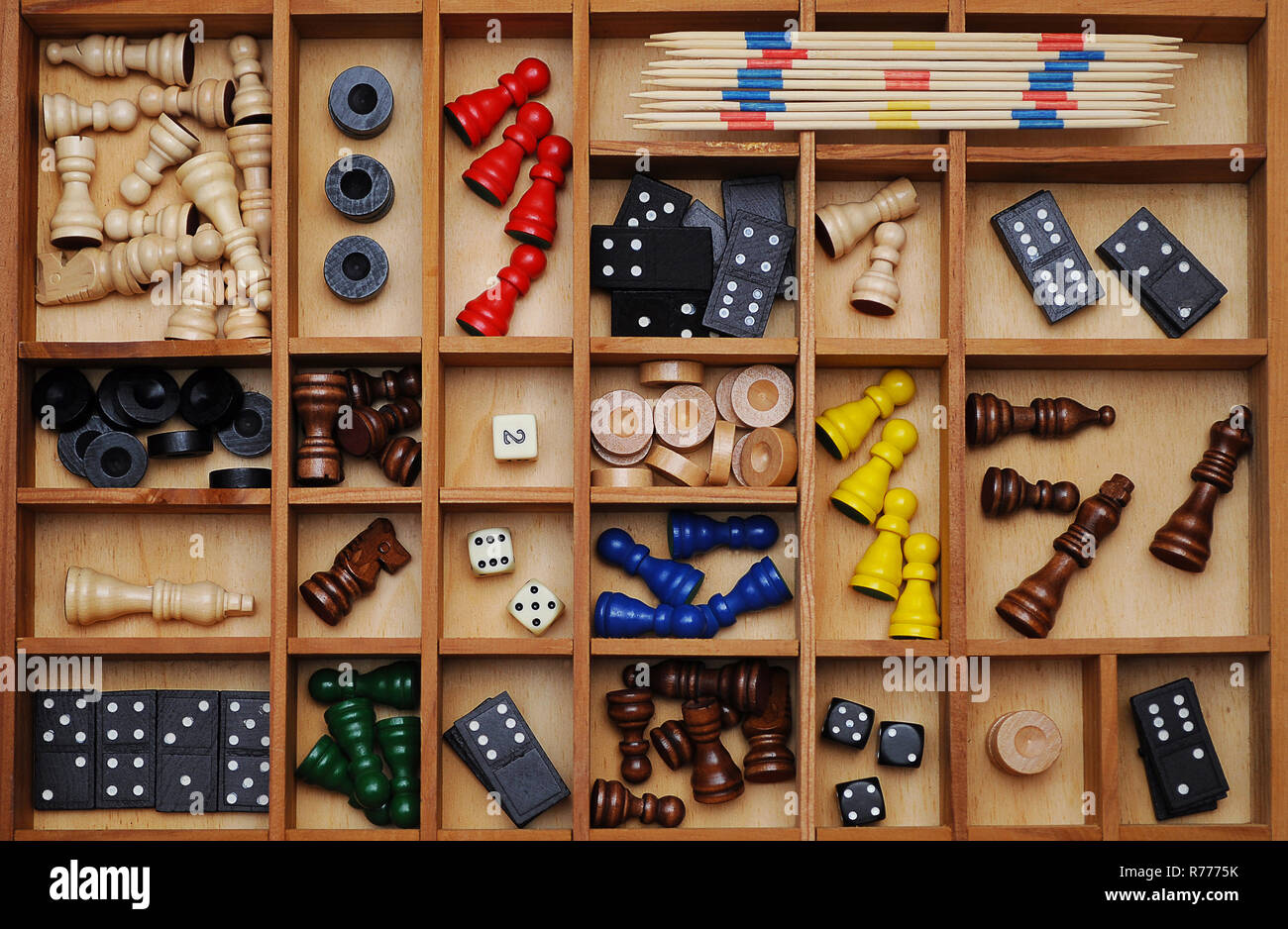 Wooden figures of board games, gaming pieces, dice, dominoes, Mikado