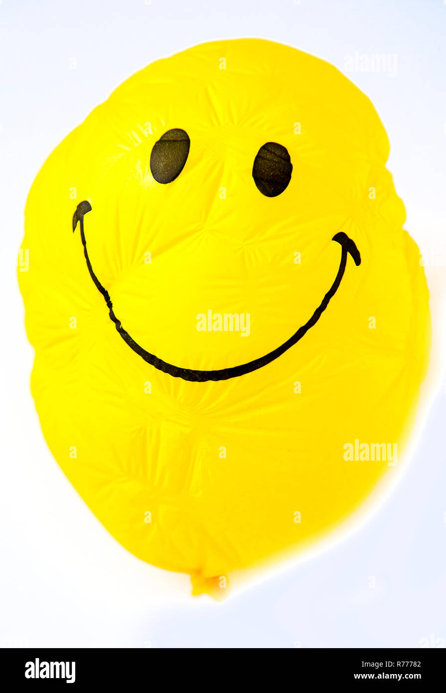 Yellow smiley face balloon hi-res stock photography and images - Alamy