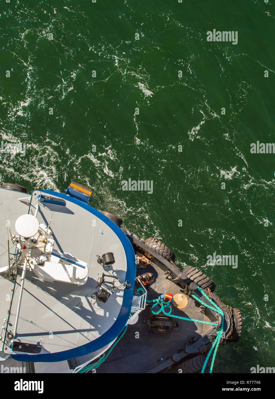Tug Boat Guiding Ship In Port High Resolution Stock Photography and ...