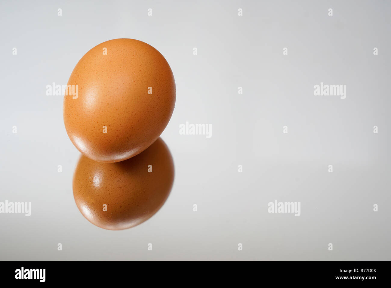 An egg on a mirror Stock Photo Alamy