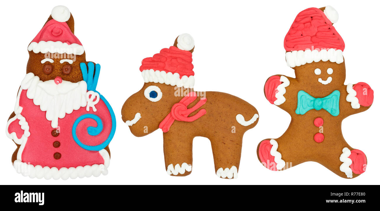 Christmas market gingerbread santa claus with reindeer moose elk figures food cookie isolated on a white background Stock Photo