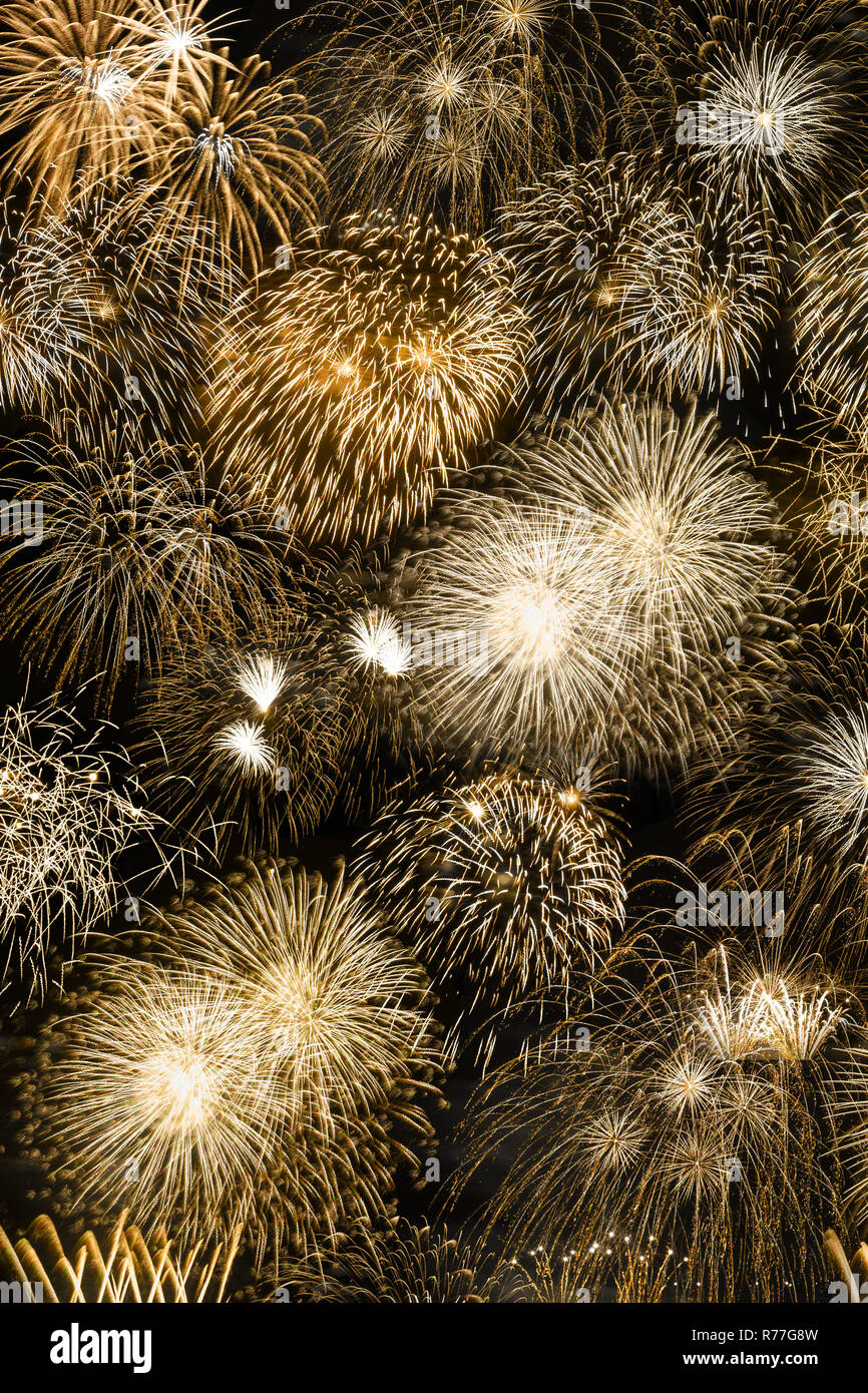 New Year's Eve fireworks gold golden background portrait format years year firework backgrounds Stock Photo