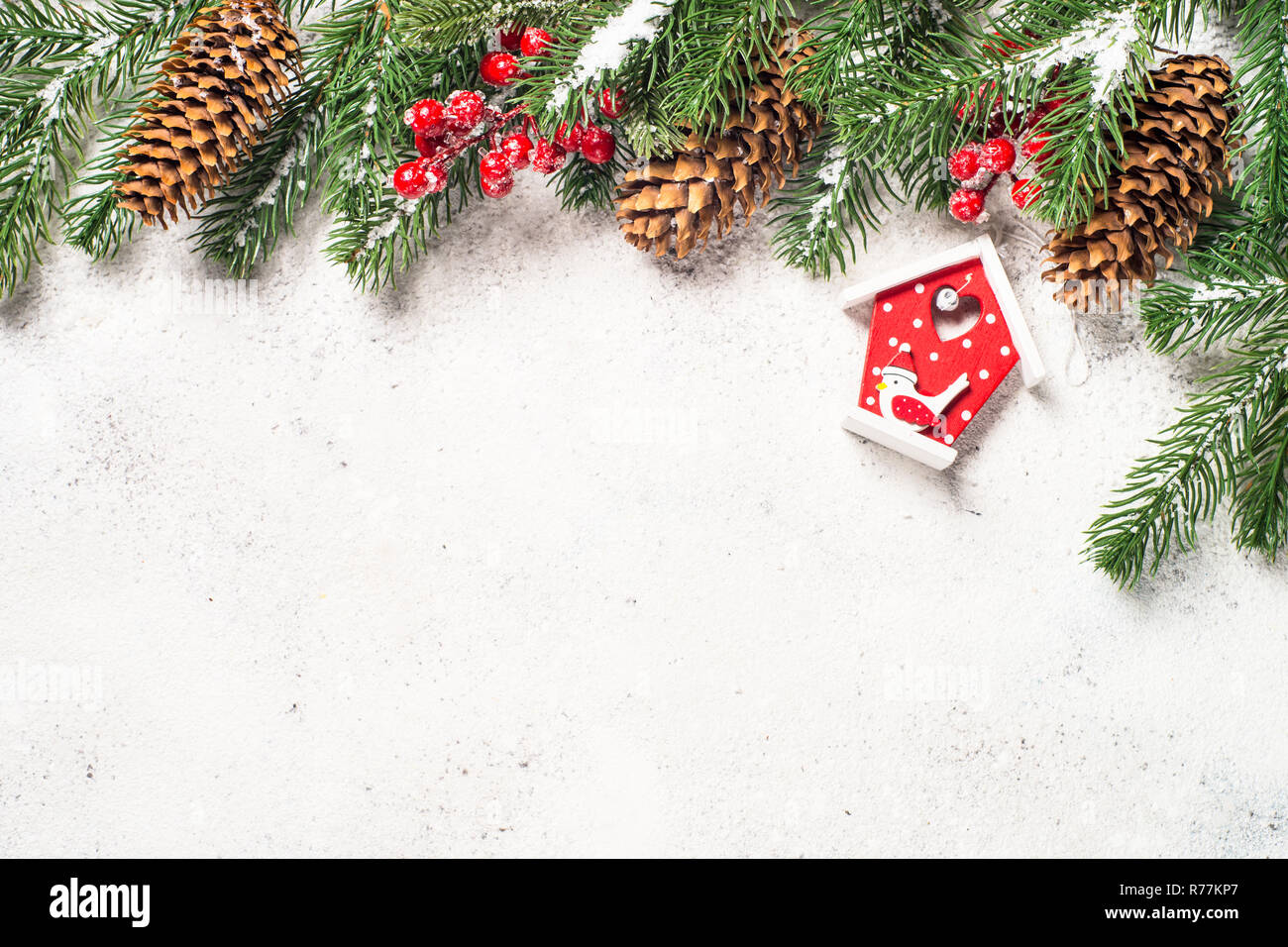Christmas background with fir tree and cones on white backgroun Stock ...