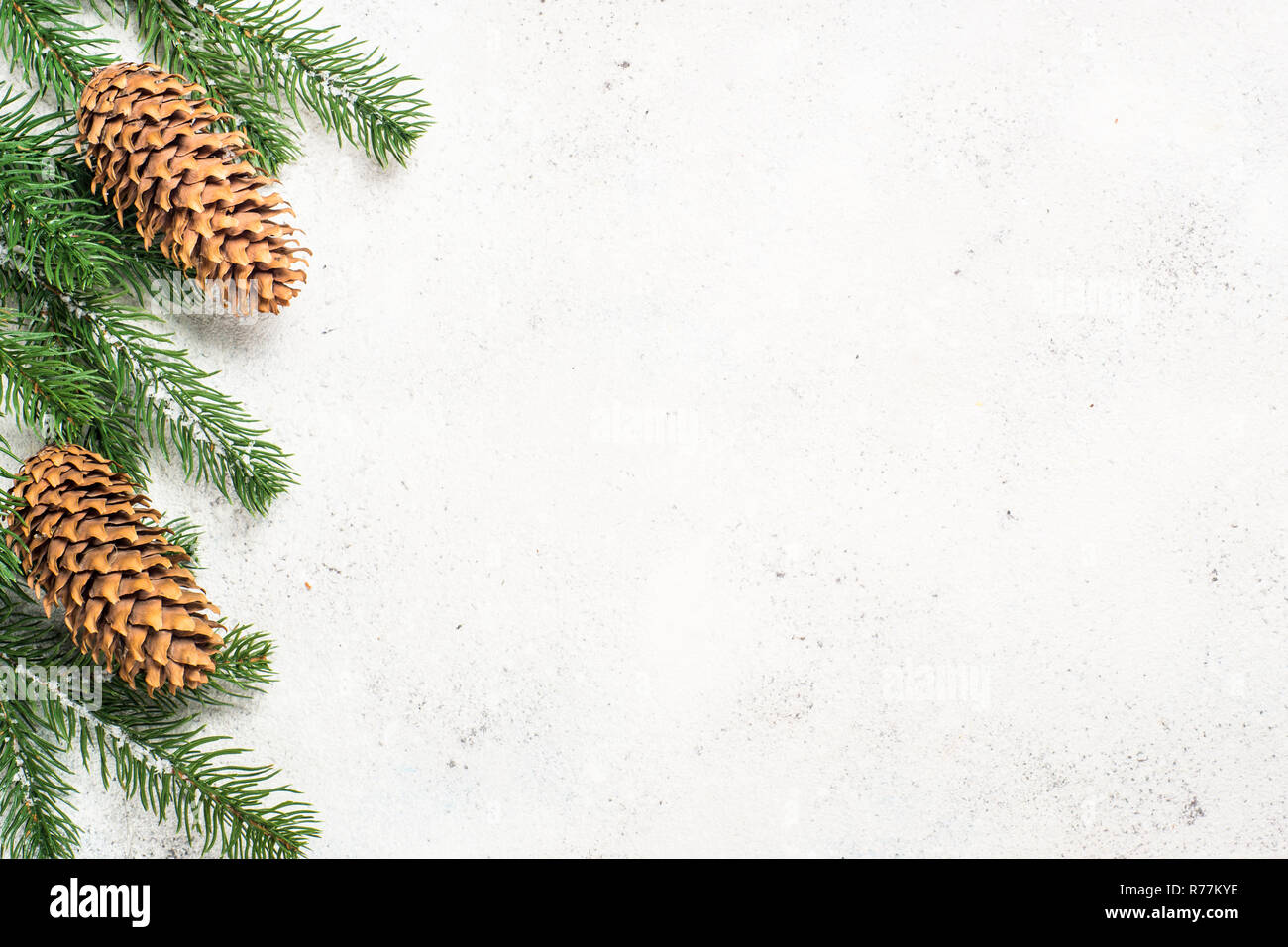 Christmas background with fir tree and cones on white backgroun Stock ...