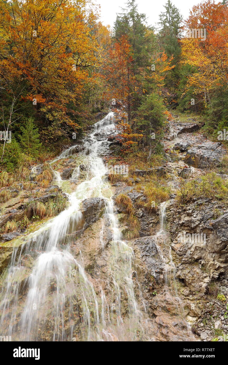 small waterfall in autumnal landscape Stock Photo