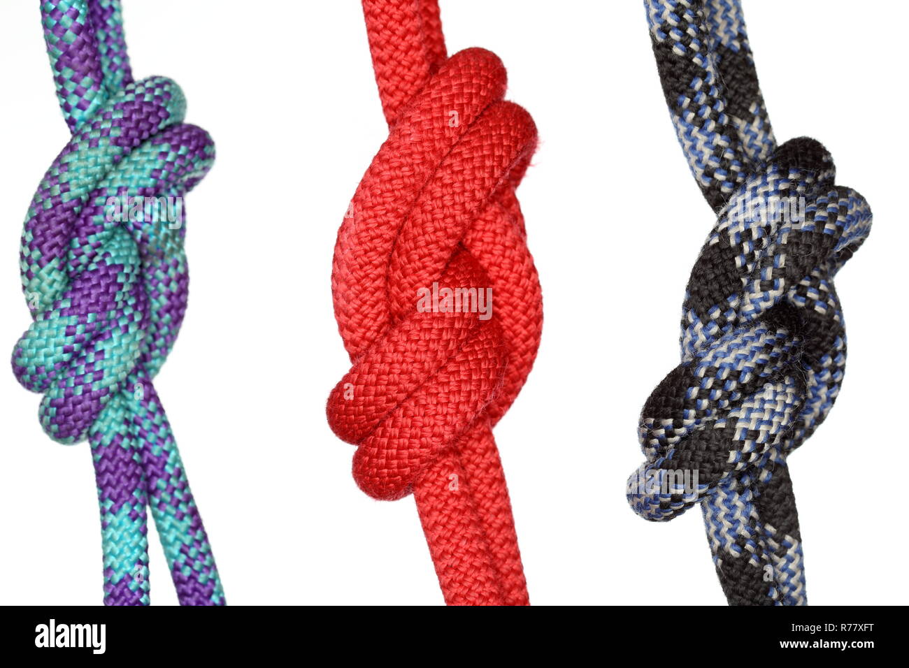 three different colored ropes with knots Stock Photo