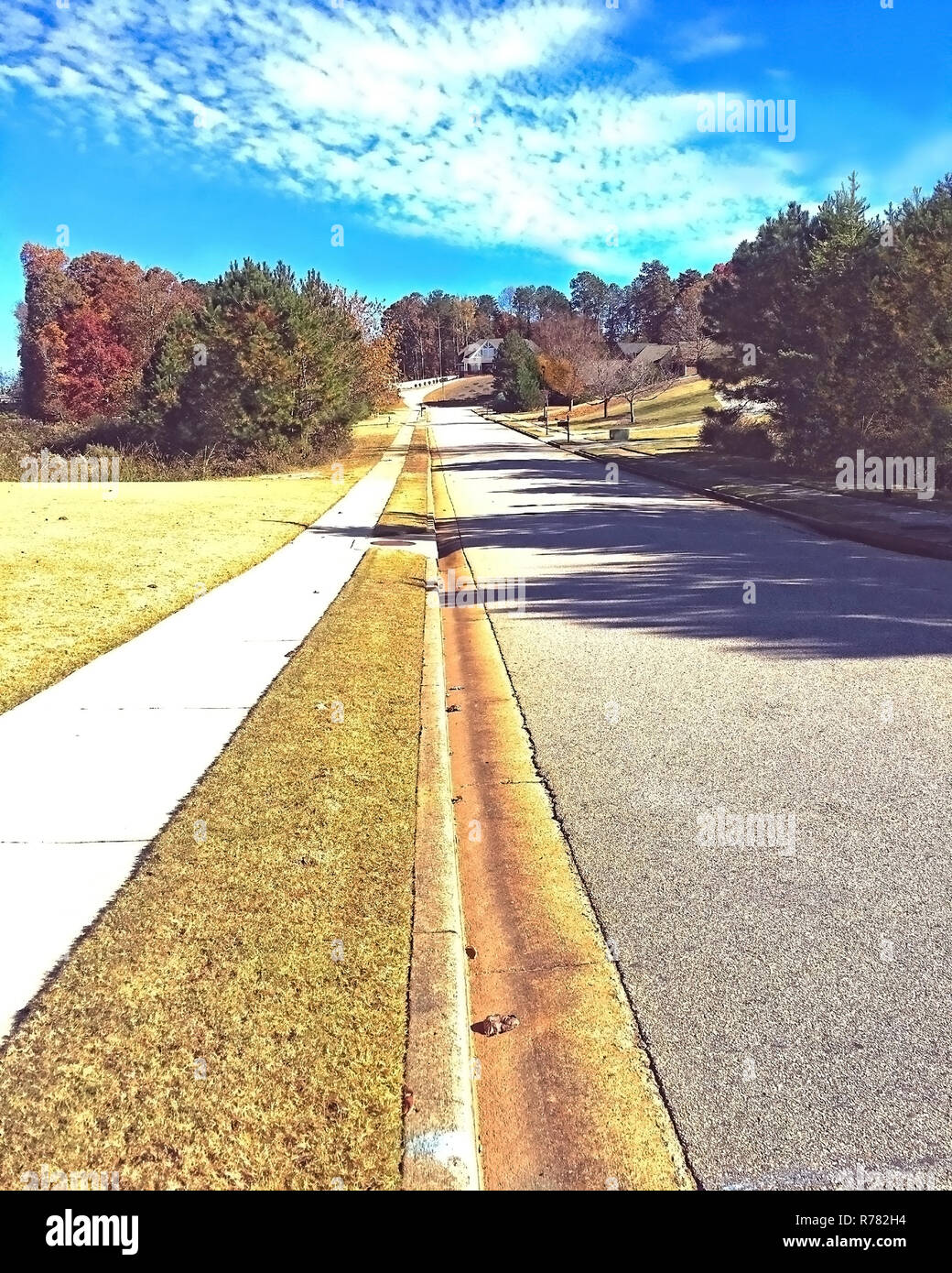 Sidewalk and Street in a Neighborhood Stock Photo