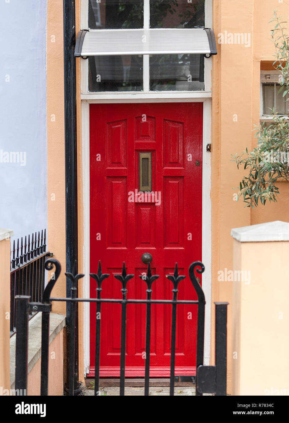Decorative red door to the London house, typical architectural feature, London, United Kingdom. Stock Photo