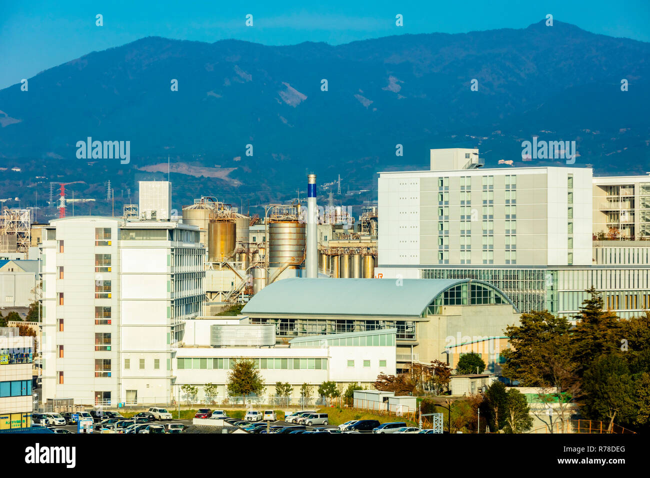 Mishima, Shizuoka / Japan - December 1 2018: Mishima modern city centre near JR railway station dense buildings with mountains in background Stock Photo