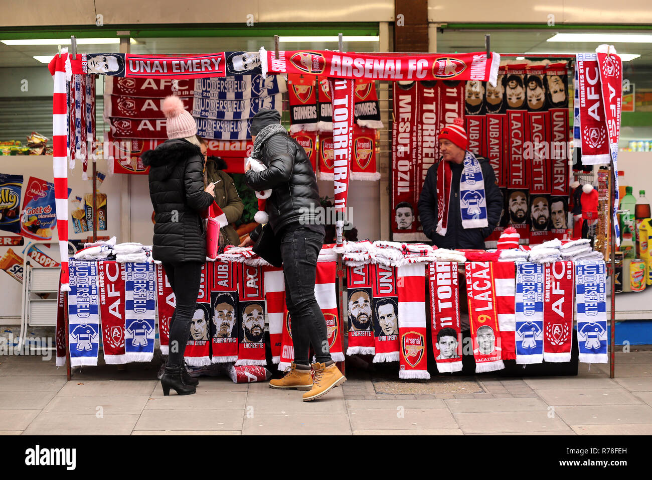 Arsenal fans shop for scarves at a stall outside the ground ahead of the  Premier League match at the Emirates Stadium, London Stock Photo - Alamy