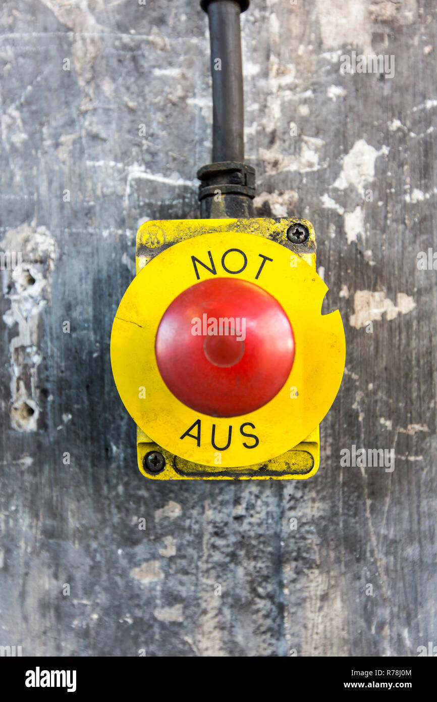 Button, emergency stop in German, Germany Stock Photo