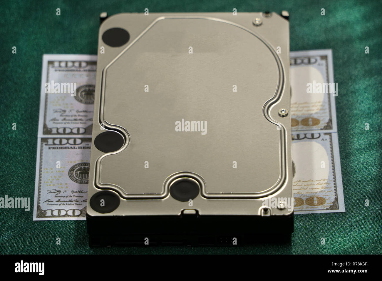 money closeup portable hard drive storage on dollar piles, on white