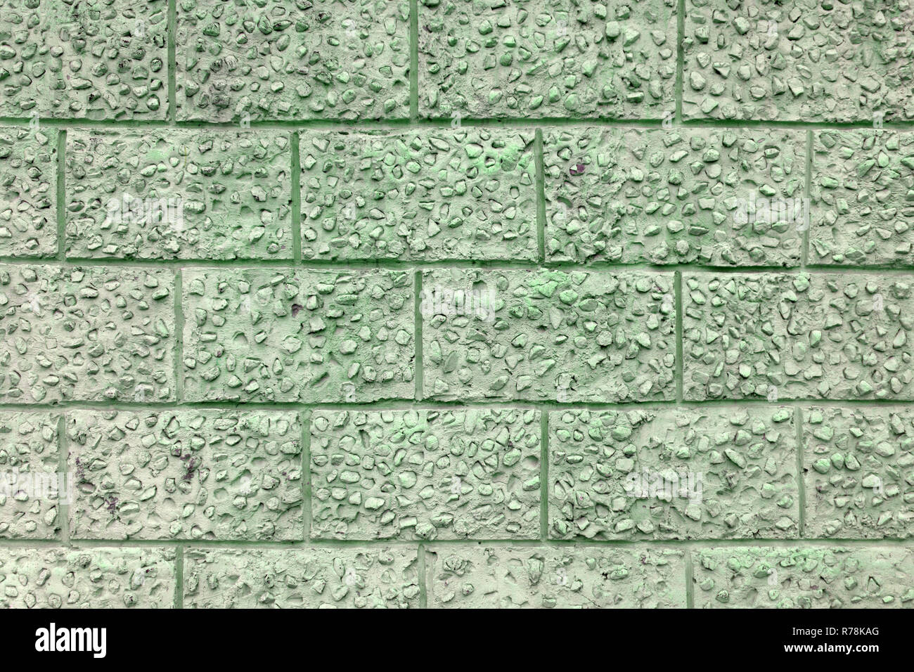 Decorative plaster under a large brick clean Stock Photo