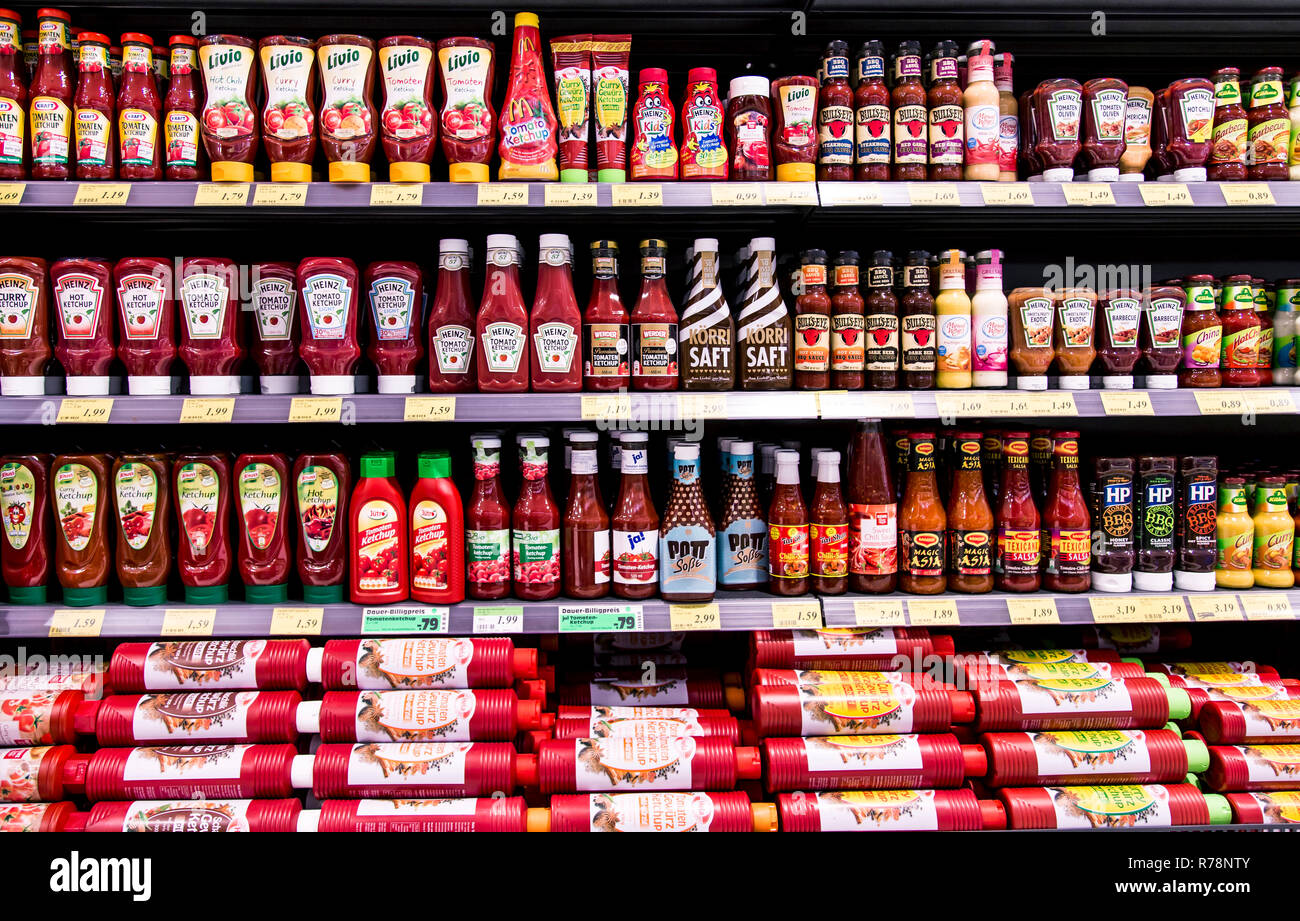 Shelf with various ketchups and sauces, supermarket, Germany Stock