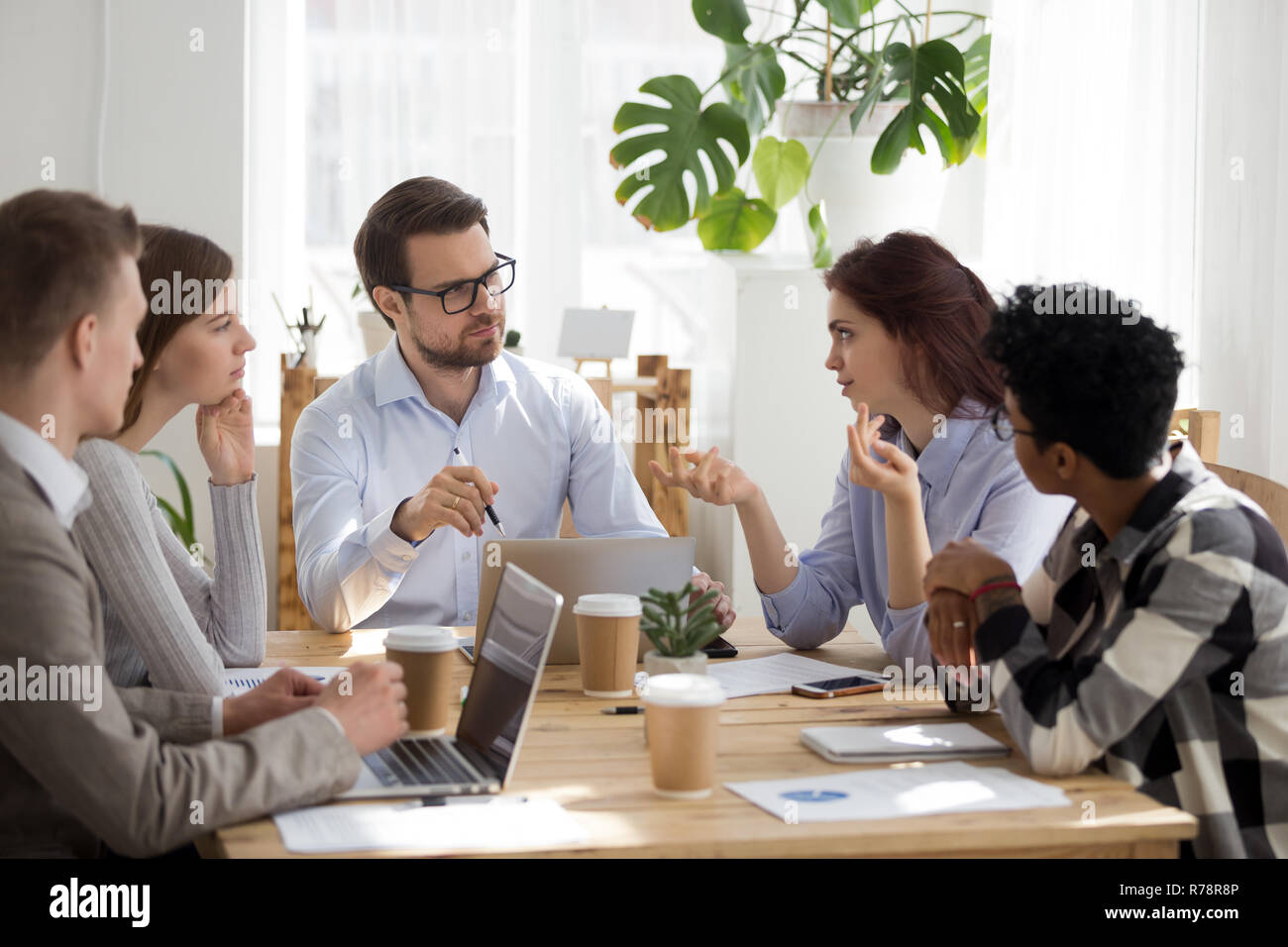 Diverse employees brainstorm at business office meeting Stock Photo