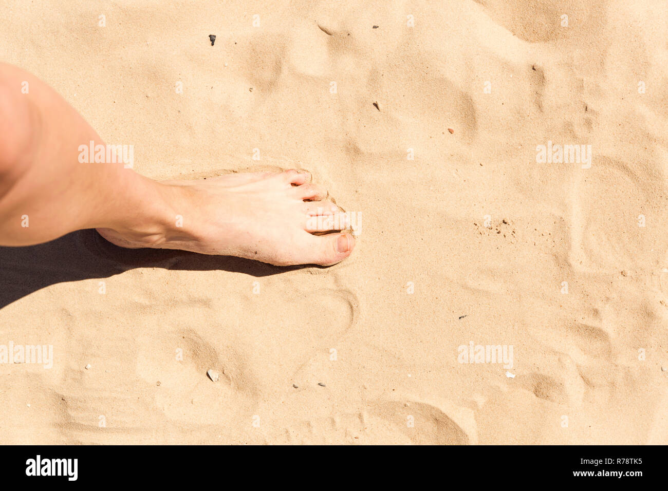 Feet in the sand. Summer vacation concept Stock Photo