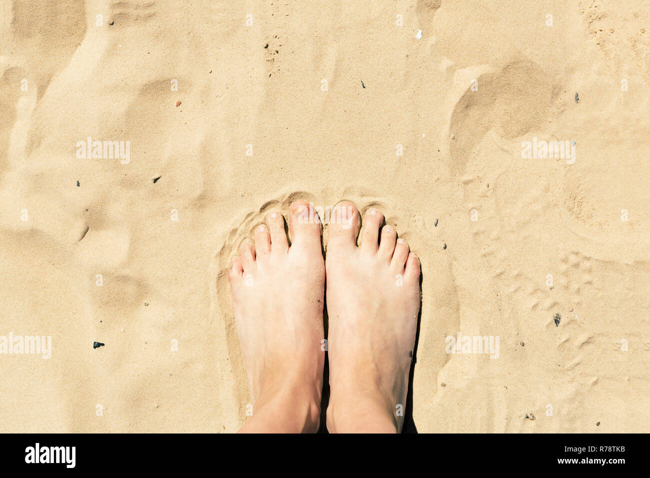 Feet in the sand. Summer vacation concept Stock Photo