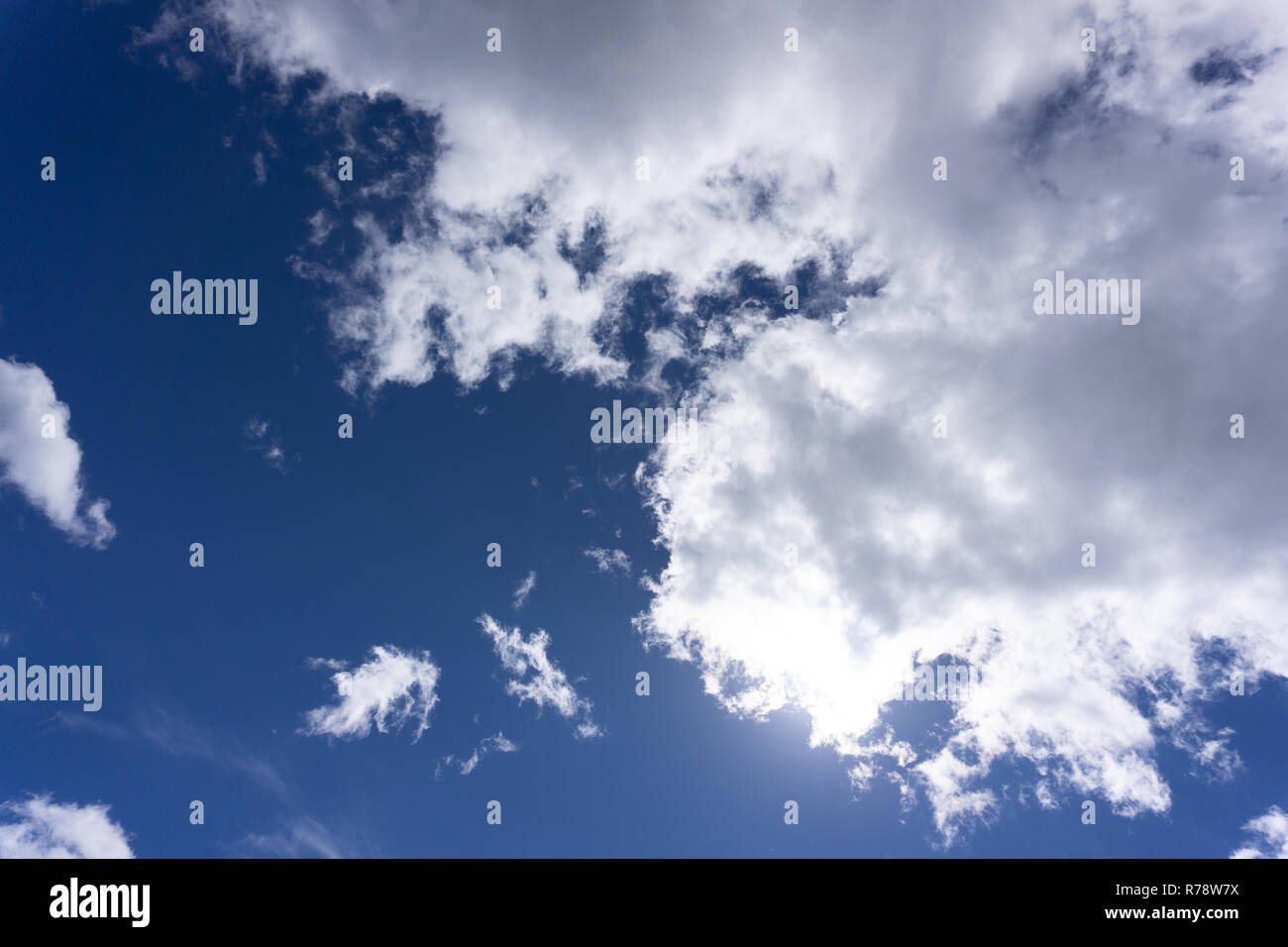 Bright blue sky with white clouds high light Stock Photo - Alamy