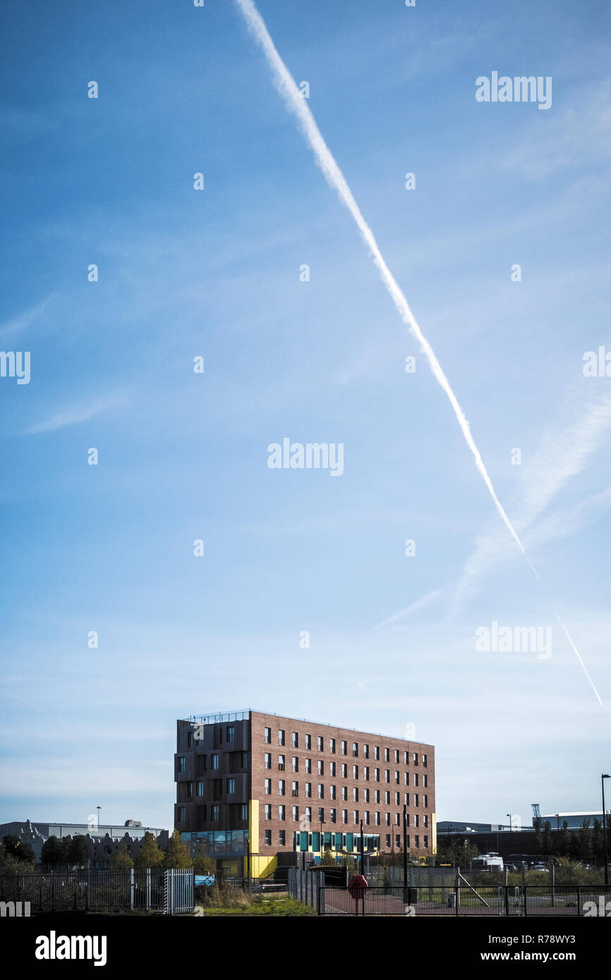 An modern office block stands  surrounded by older low rise buildings in Cardiff, Wales, UK Stock Photo