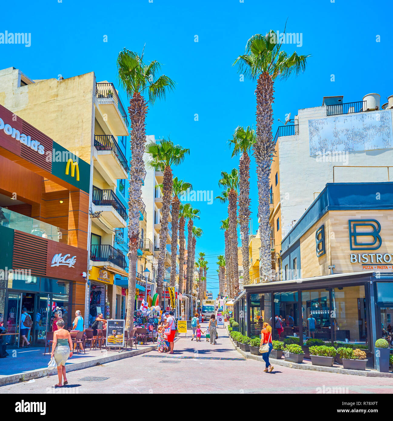 BUGIBBA, MALTA - JUNE 14, 2018: The Pjazza Walkway is the narrow street with the greatest concentration of restaurants and souvenir shops, on June 14  Stock Photo