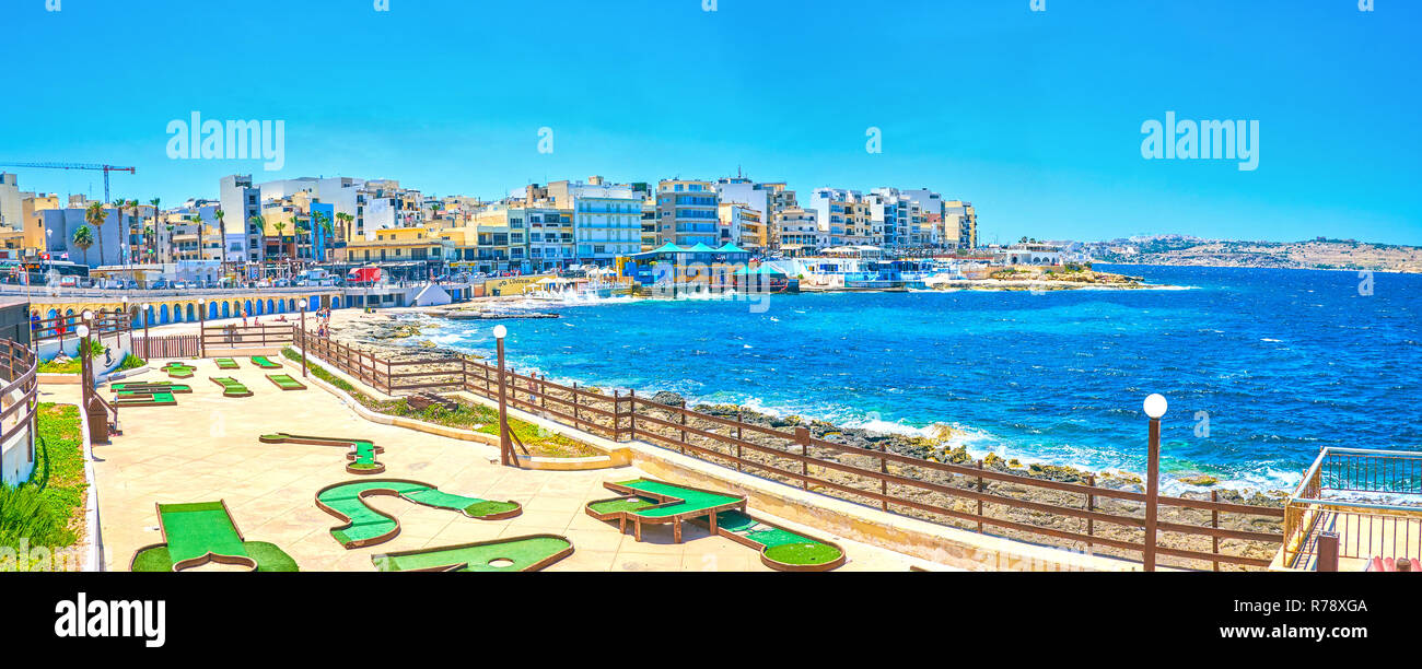 BUGIBBA, MALTA - JUNE 14, 2018: The small golf course for beginners located at the shoreline of the resort, on June 14 in Bugibba. Stock Photo