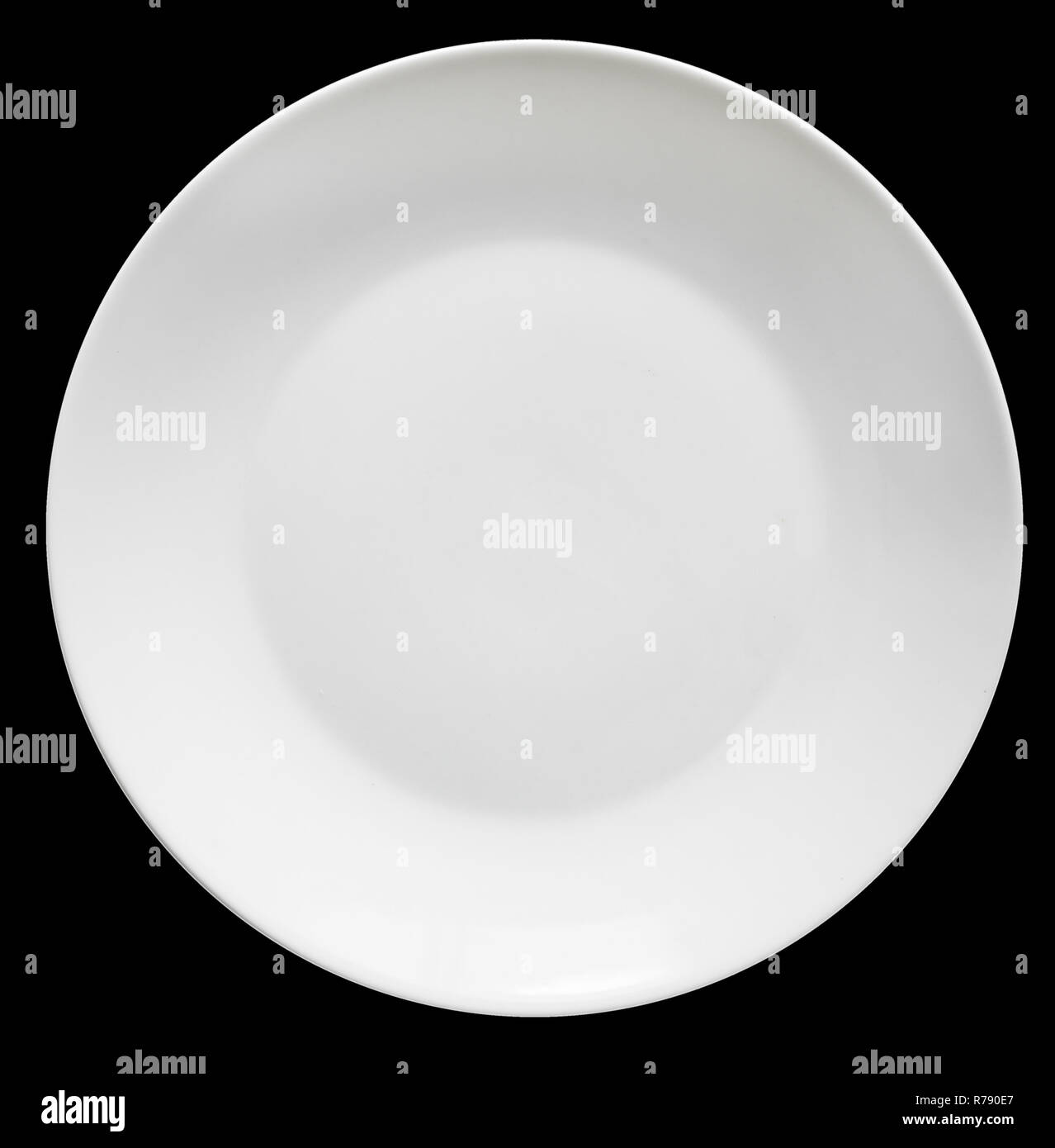 White plate isolated on black background Stock Photo - Alamy