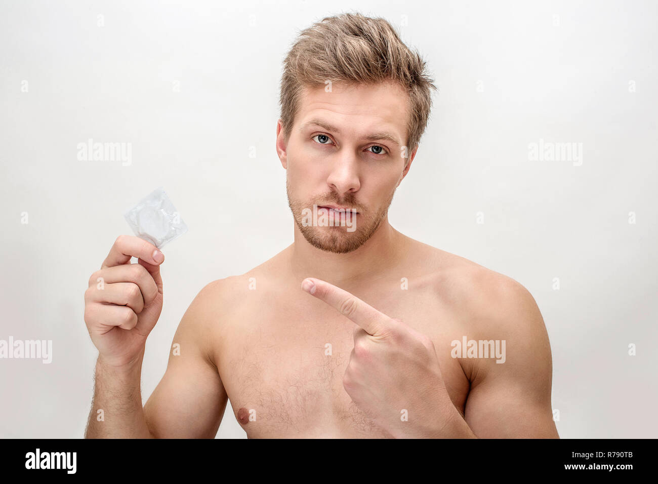 Male condom hand hi-res stock photography and images - Alamy