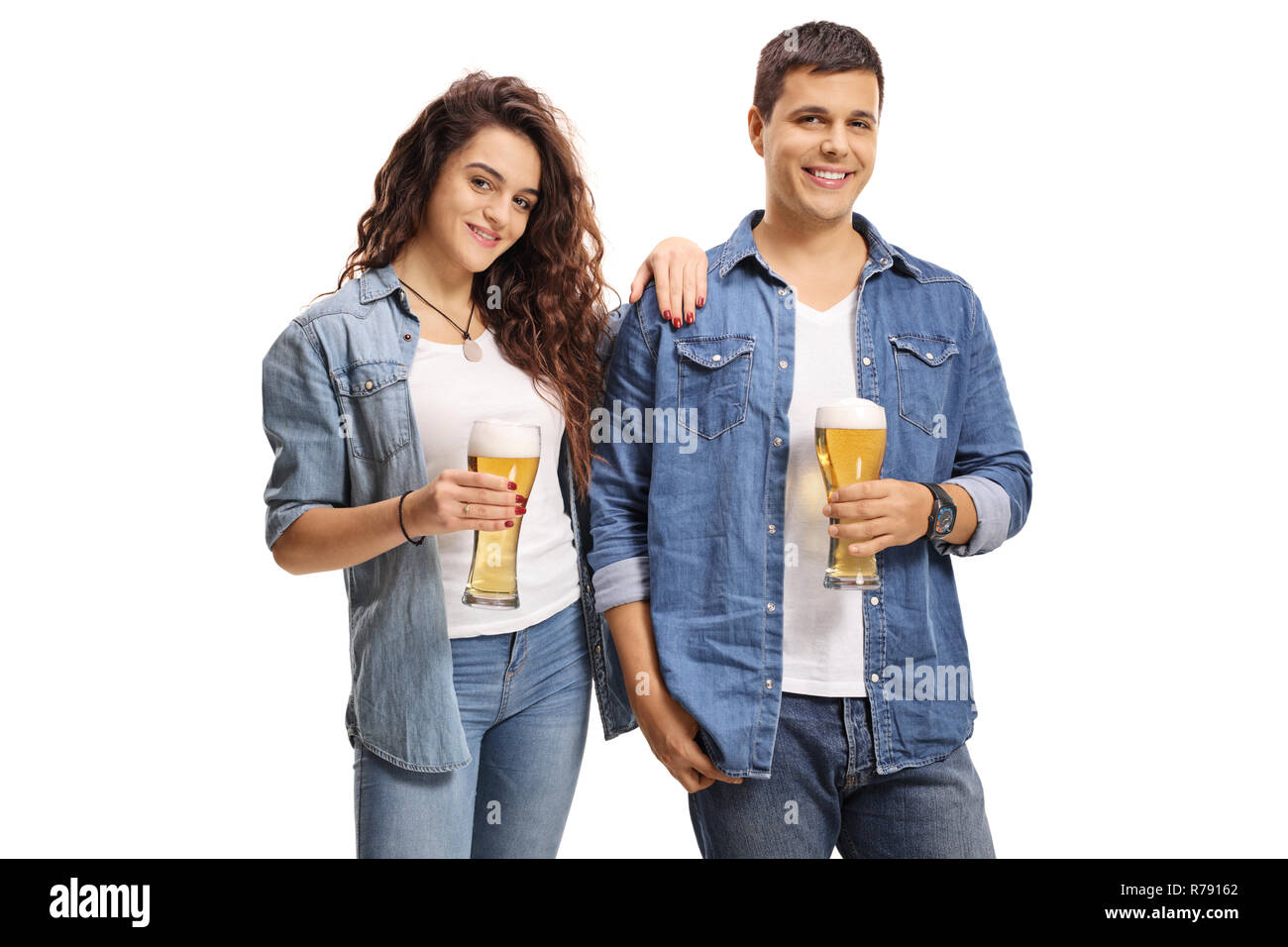 Young guy and a girl holding glasses of beer isolated on white background Stock Photo