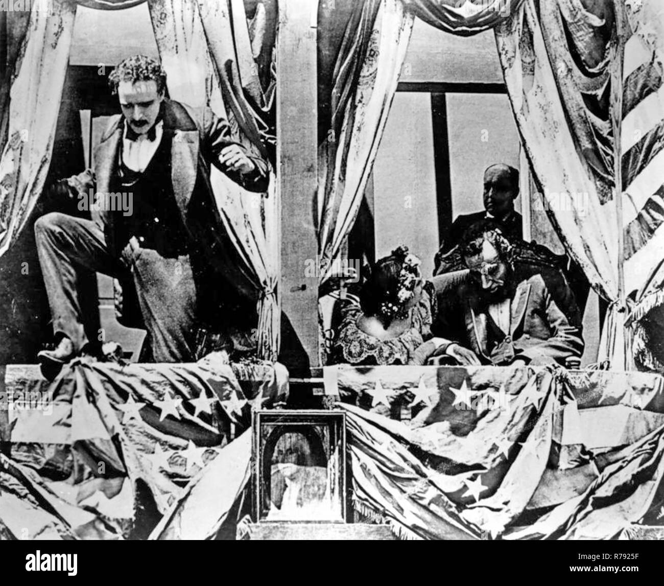 BIRTH OF A NATION 1915 D.W.Griffith silent film with Raoul Walsh as John Wilkes Booth escaping from Ford's Theatre after assassinating Lincoln played by Joseph Henabery Stock Photo