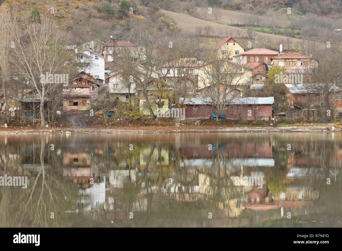 reflection of Çubuklu village in the calm water of Çubuklu lake in the Bolu mountains of Turkey Stock Photo