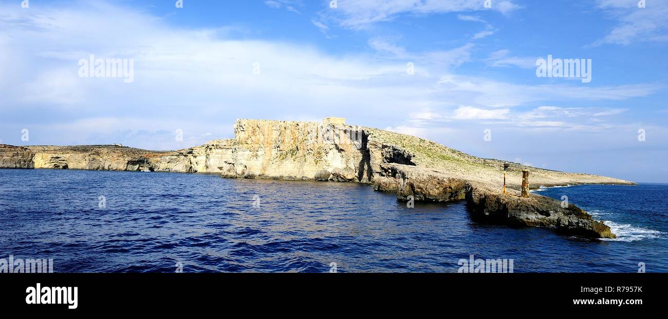 Coimino, Malta - 12th October 2018:Visitors expoloring the cliffs of Comino and St Marys watch Tower Stock Photo