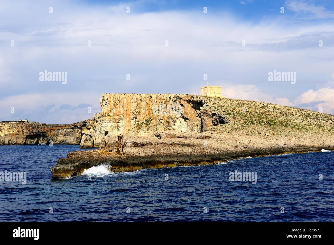 Coimino, Malta - 12th October 2018:Visitors expoloring the cliffs of Comino and St Marys watch Tower Stock Photo