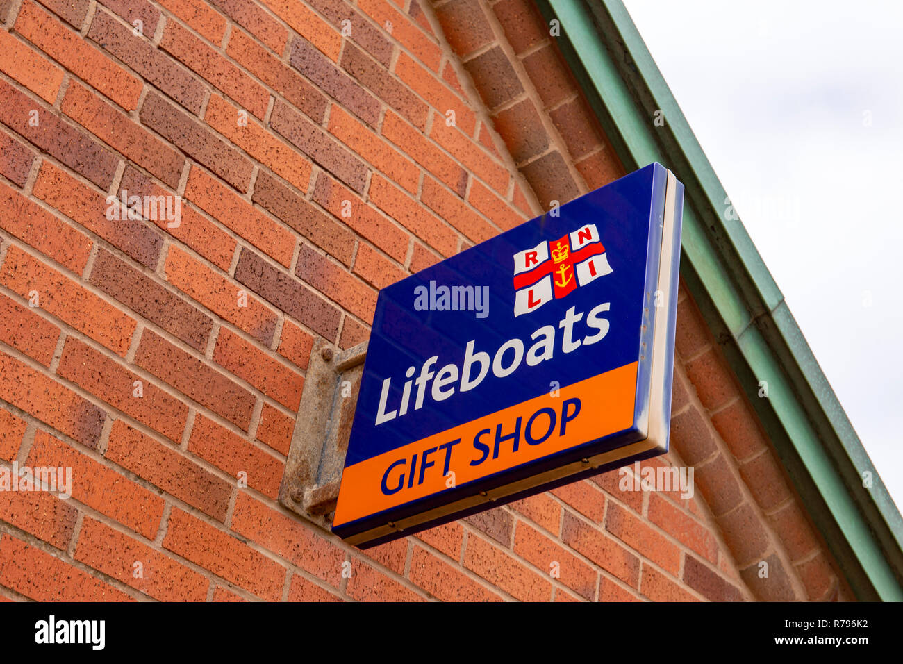RNLI Lifeboats gift shop sign on outside wall in Blackpool Lancashire UK Stock Photo