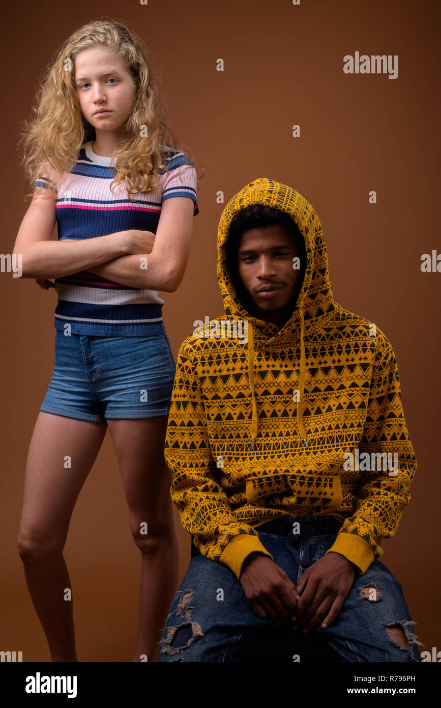 Portrait of young African man and Caucasian teenage girl Stock Photo