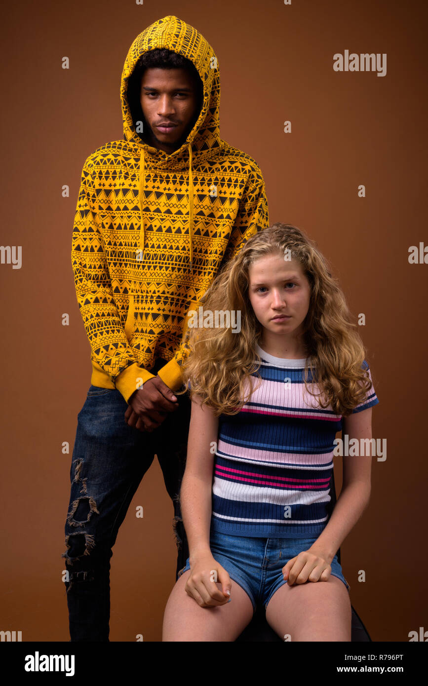 Portrait of young African man and Caucasian teenage girl Stock Photo