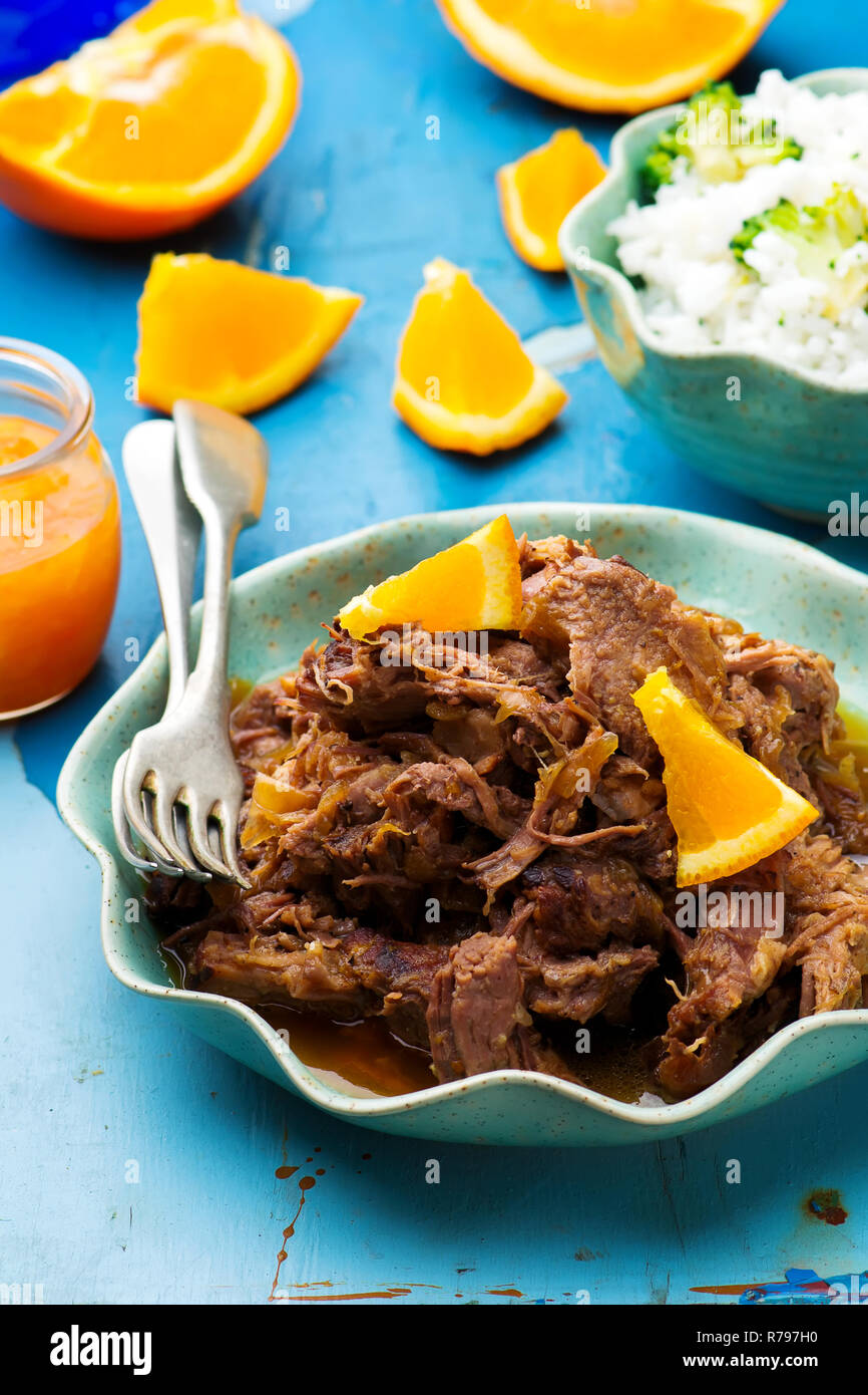 Slow Cooker Braised Pork with a RumOrange Sauce.selective focus Stock