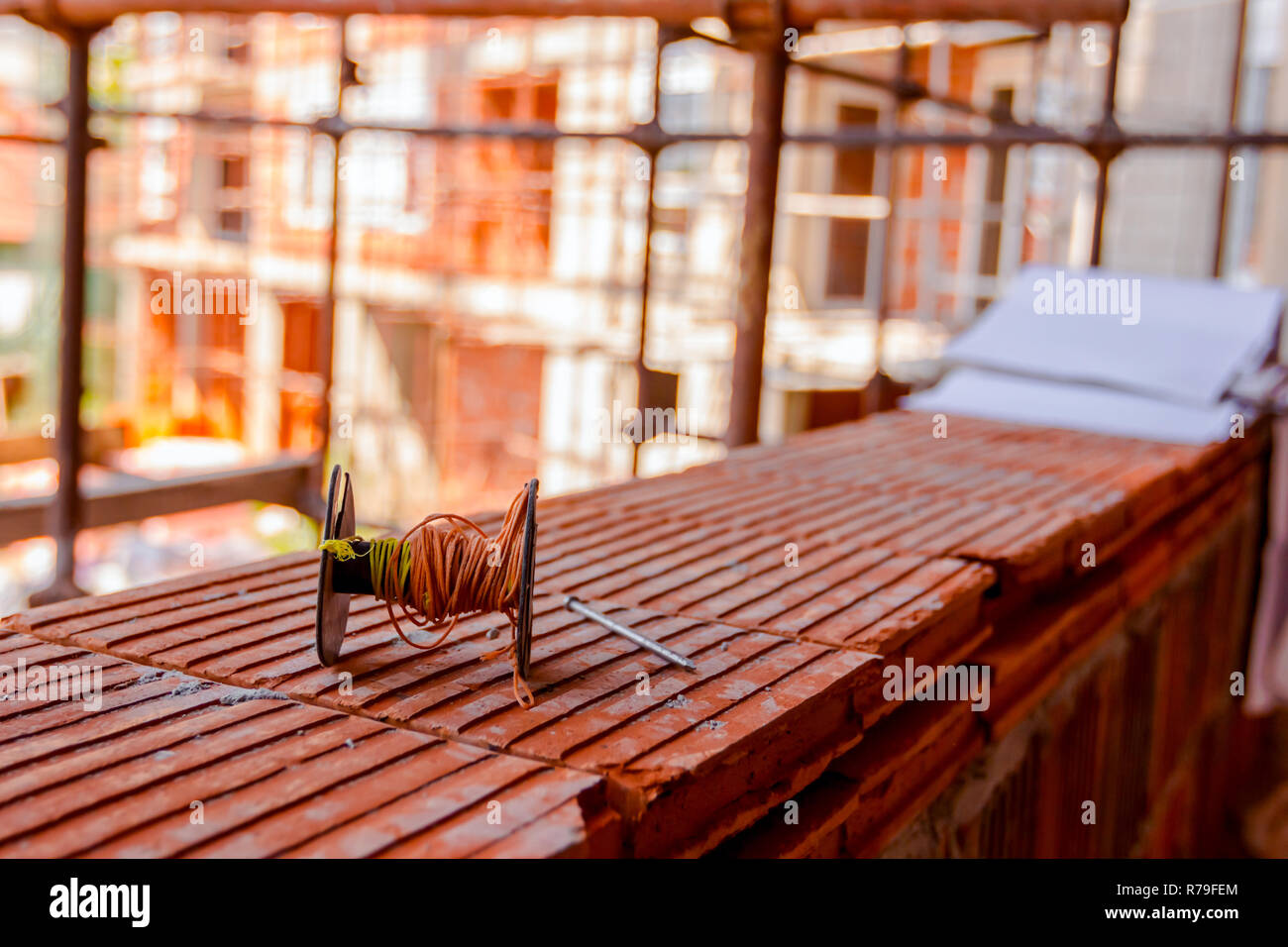 Spool Of Construction String Line Is Placed On Red Blocks. Tool To Help  Worker For Set Straight Distances On New Edifice. Stock Photo, Picture and  Royalty Free Image. Image 113794710.