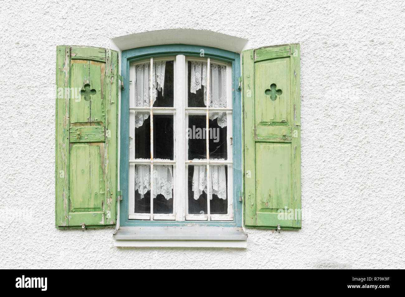window with shutters on an old residential house Stock Photo