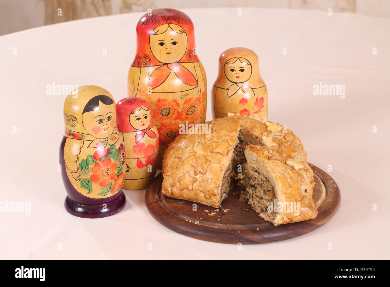 Homemade Russian pie Kurnik with chicken, potatoes and onions close-up on a  slate board on the table. horizontal Stock Photo - Alamy