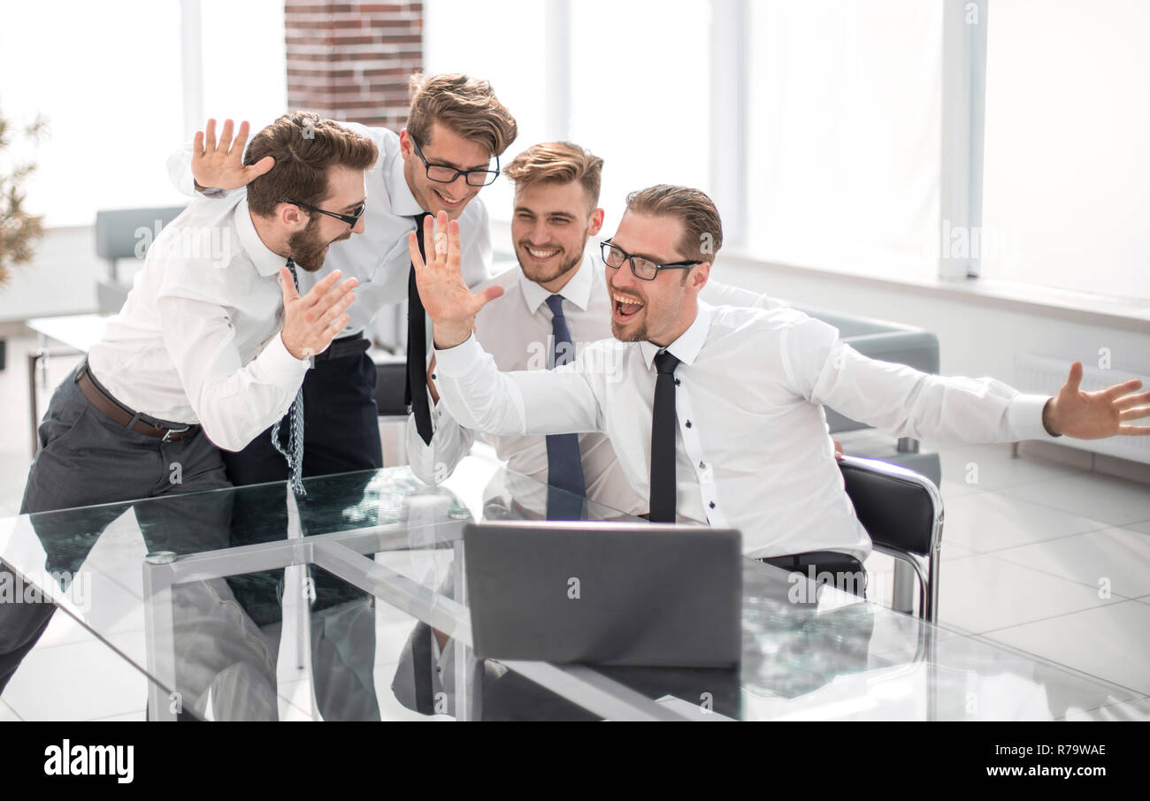 team of like-minded people giving each other a high five Stock Photo ...