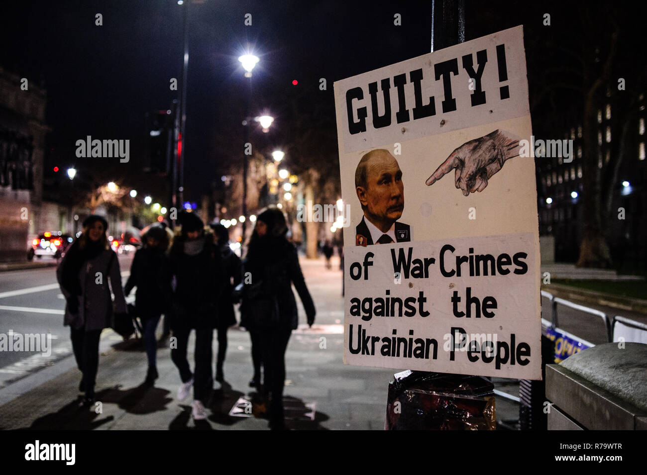 A placard with Putin's picture seen on a street pole during the demonstration. Ukrainian expats held an anti-Putin demonstration opposite Downing Street on Whitehall in central London. Tensions between Ukraine and Russia have reached a new height in recent weeks with the Russian seizure of three Ukrainian naval vessels, prompting Ukraine to declare martial law in several border regions. Stock Photo
