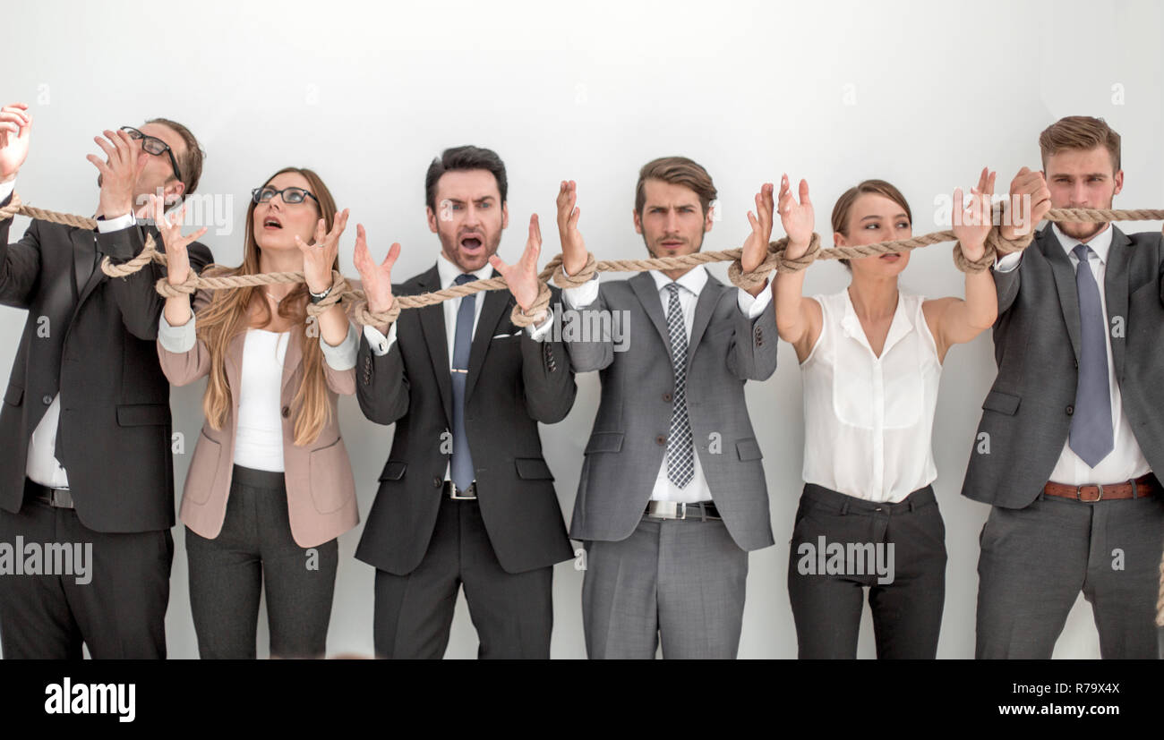 scared group of business people tied with a rope Stock Photo - Alamy