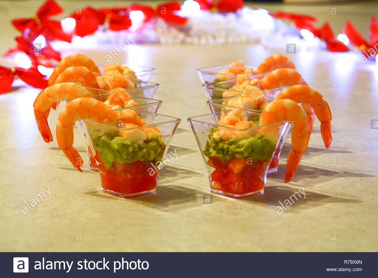 Appetizing Shot Glass Cocktail Of Prawn On Avocado And Tomatoes