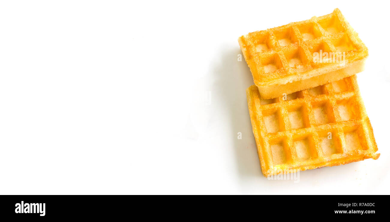 Close-up of tasty Fresh brown Waffles isolated on white Background. Stock Photo