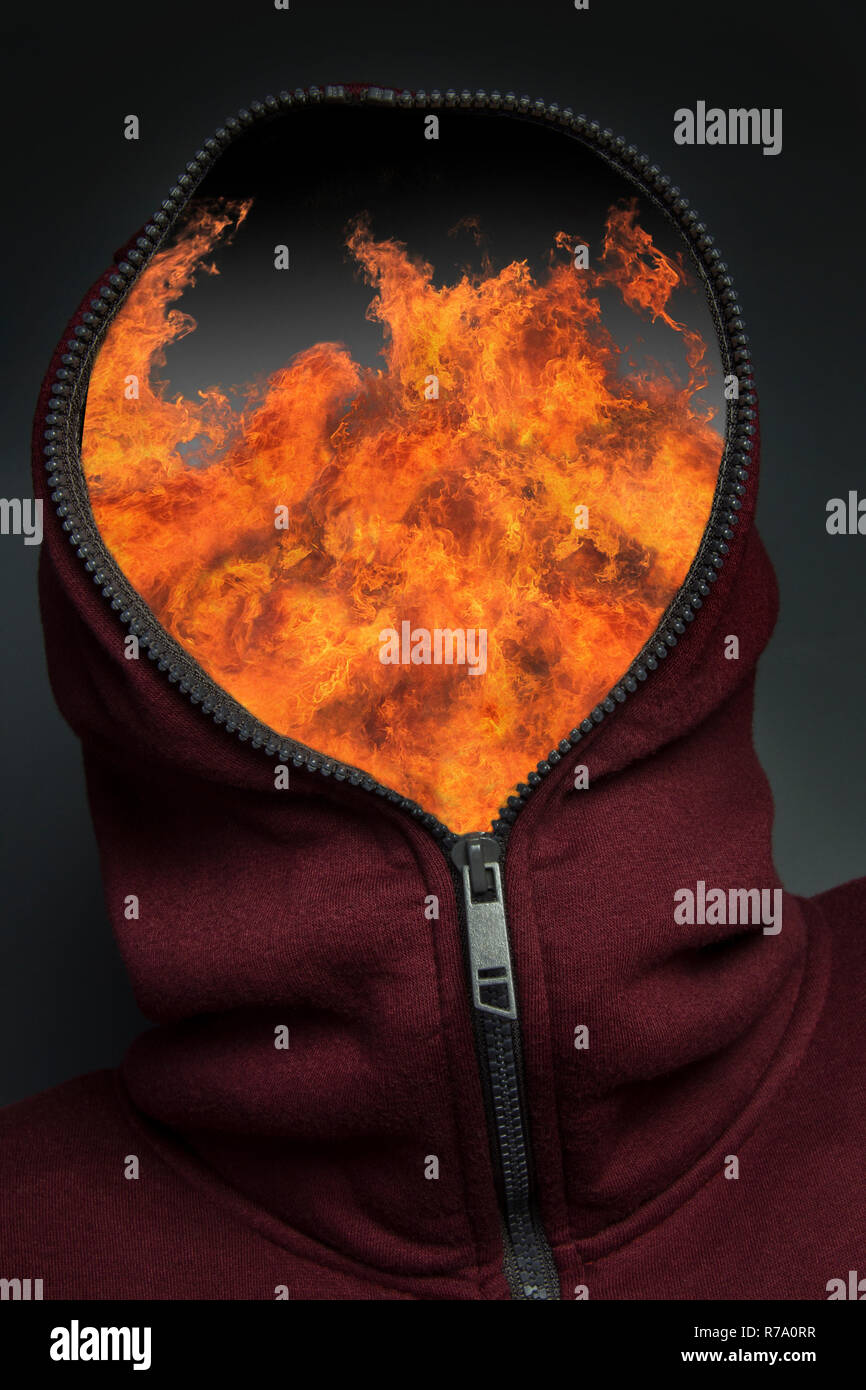 Man in hoody with a look of fear and surprise on his face. Stock Photo