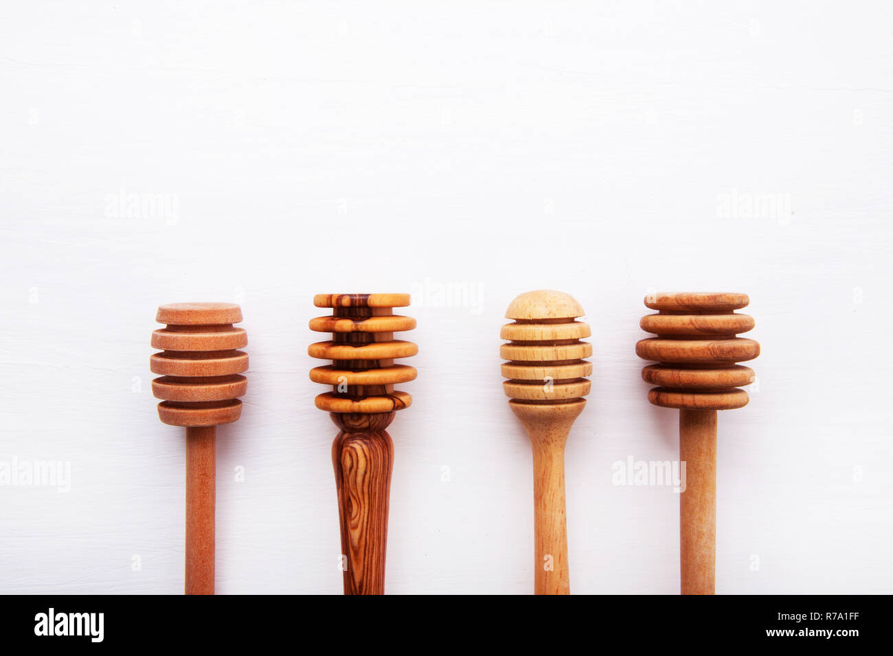 wooden honey stick isolated on white wooden background, Top view with